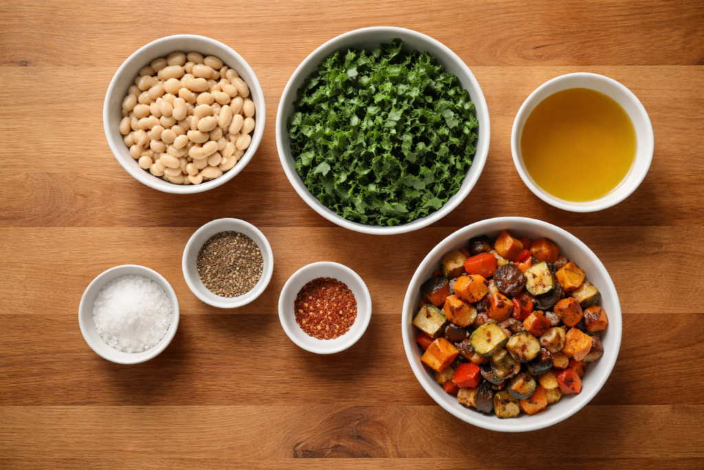 ingredients for beans and greens plate arranged on a wooden countertop